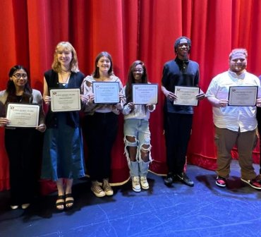 Students Holding Scholarship Certificates