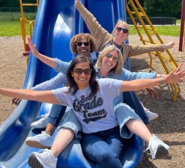 Teachers on a Playground Slide